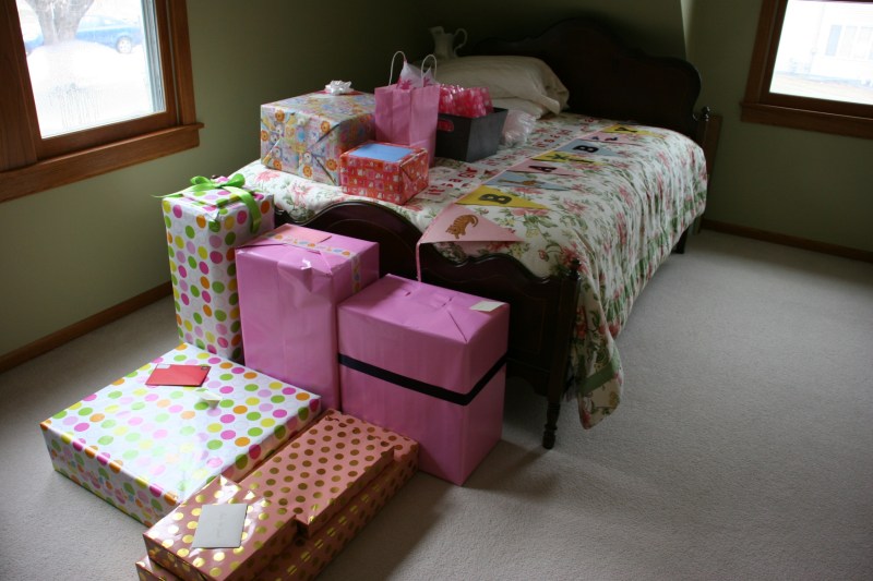 Family from across the country shipped baby gifts to my home prior to the shower. I started stacking them, along with party supplies, in my daughters' former bedroom.