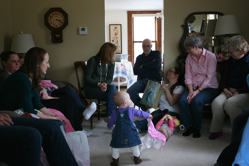 The great nieces played while their moms and others passed opened baby gifts around my living room.