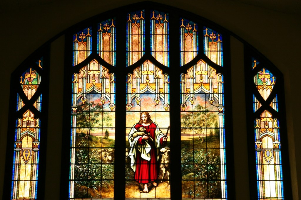 Stained glass windows fill the sanctuary, including this one in the balcony.