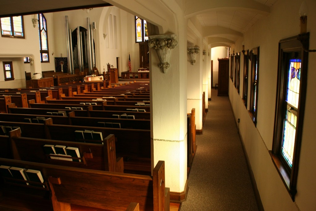 A view of a sanctuary side aisle showcases the craftsmanship of this church.