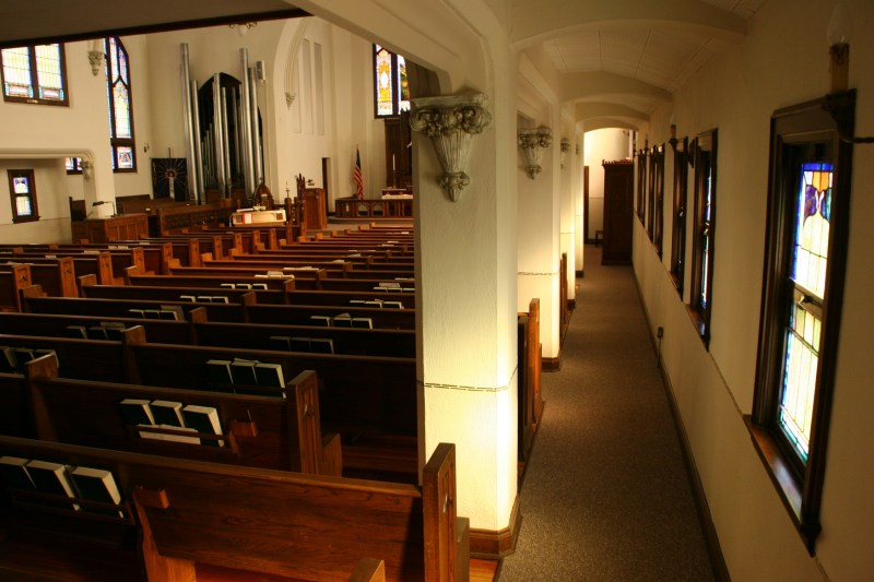 A view of a sanctuary side aisle showcases the craftsmanship of this church.