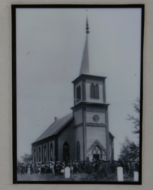 A photo of the "old church" is posted in the present church.