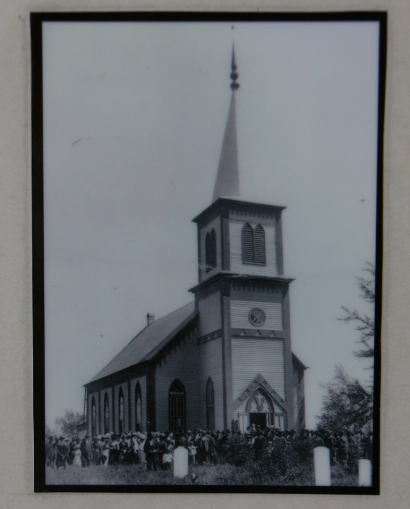 A photo of the "old church" is posted in the present church.