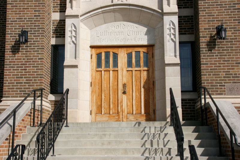 The front entry to Holden Lutheran is stunning. Faith, hope and love are chiseled above the oak doors.