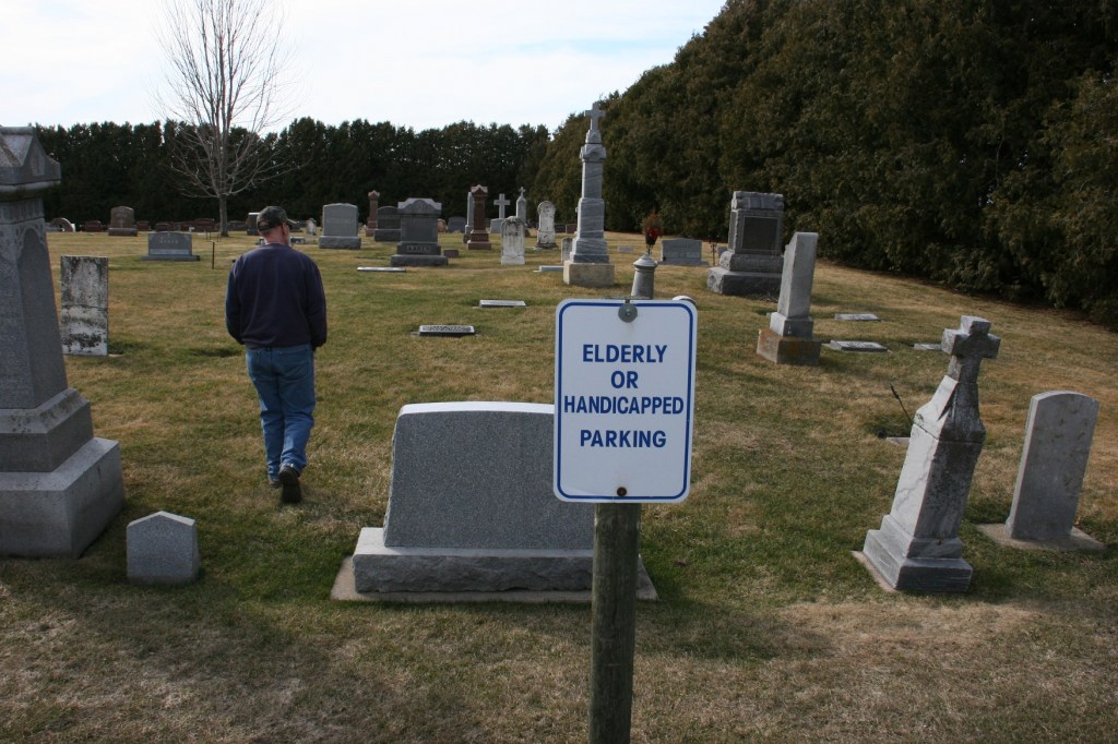 I trail Randy from the back church parking lot into another section of the cemetery.