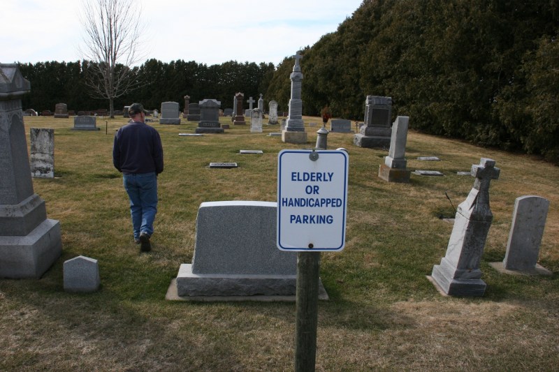 I trail Randy from the back church parking lot into another section of the cemetery.