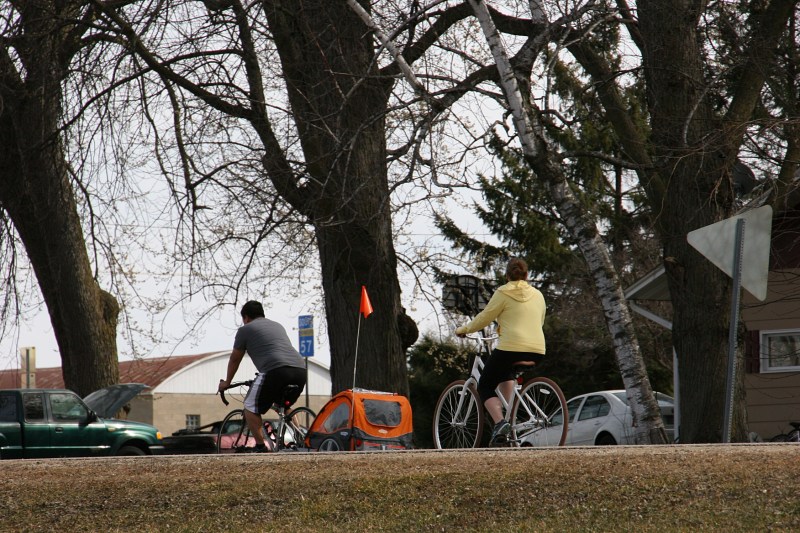 Biking along Goodhue County Road 30 past Riverside Park in Wanamingo.
