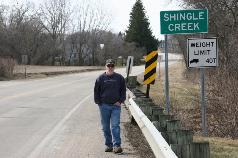 My husband, Randy, crosses the bridge across Shingle Creek in Wanamingo.