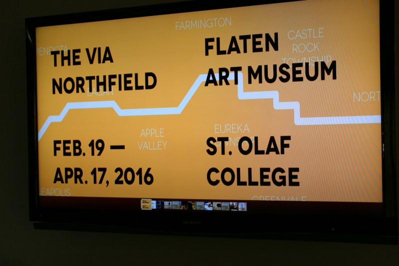 The exhibit is promoted on a screen outside The Flaten Art Museum.