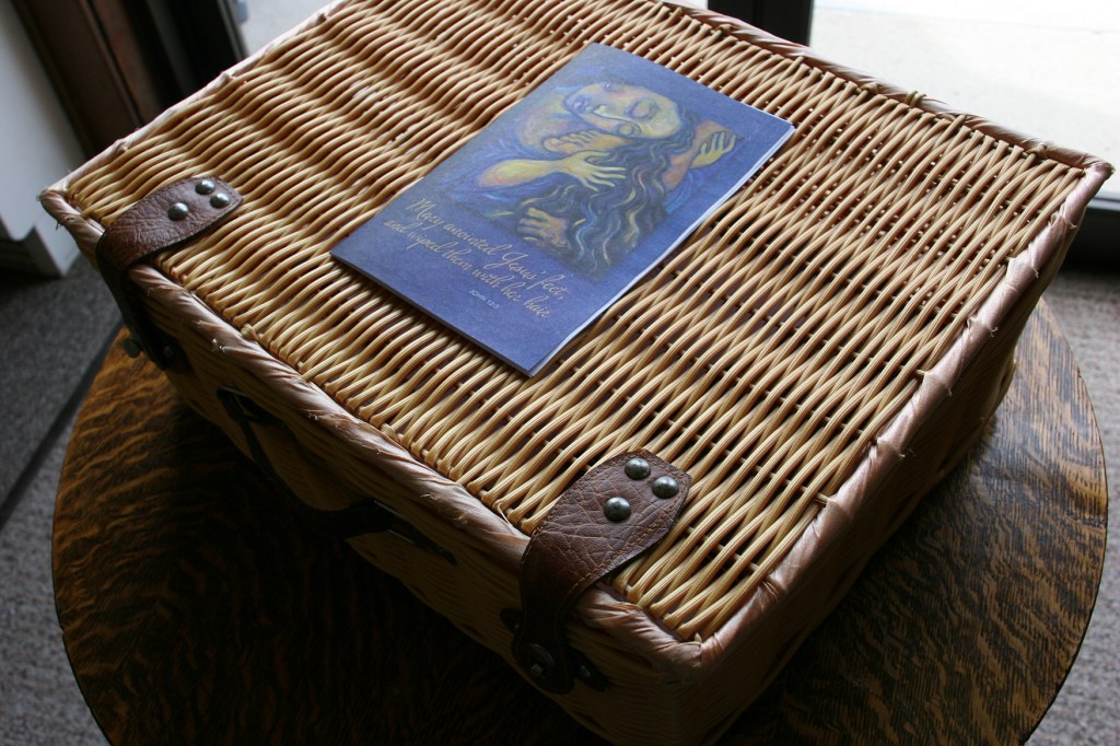 A basket holds church bulletins and other worship essentials.