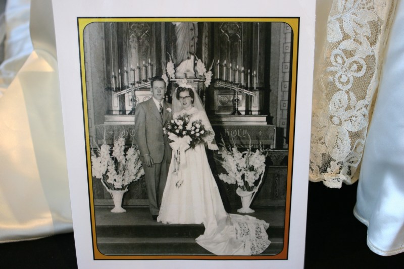 Vintage portraits are part of the exhibit, helping to tell the wedding story.
