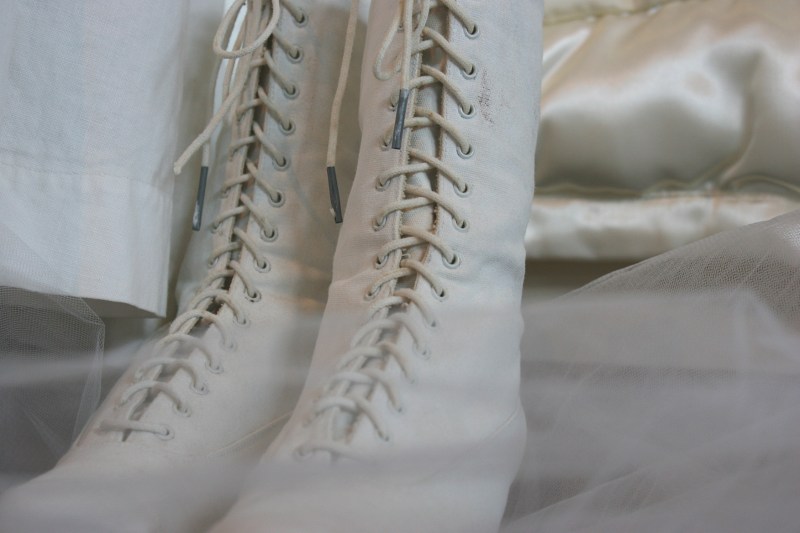 Imagine fitting your feet into these tiny boots and then attempting to lace them.