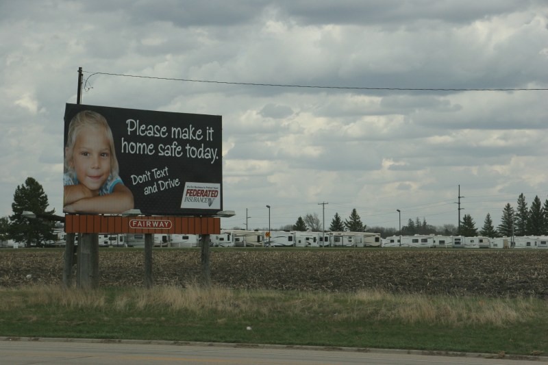 This billboard sponsored by Federated Insurance of Owatonna stands along Steele County Road 45 that runs parallel to Interstate 35 just north of Owatonna.