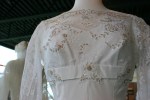 Exhibit, wedding dresses, 65 lace bodice close-up 1950s