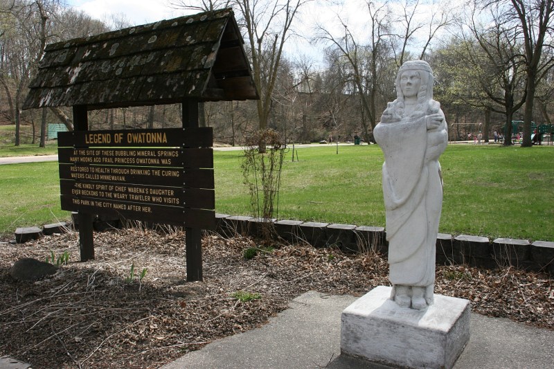 A sign explains the legend of Princess Owatonna, represented in an early 1930s statue in Mineral Springs Park.