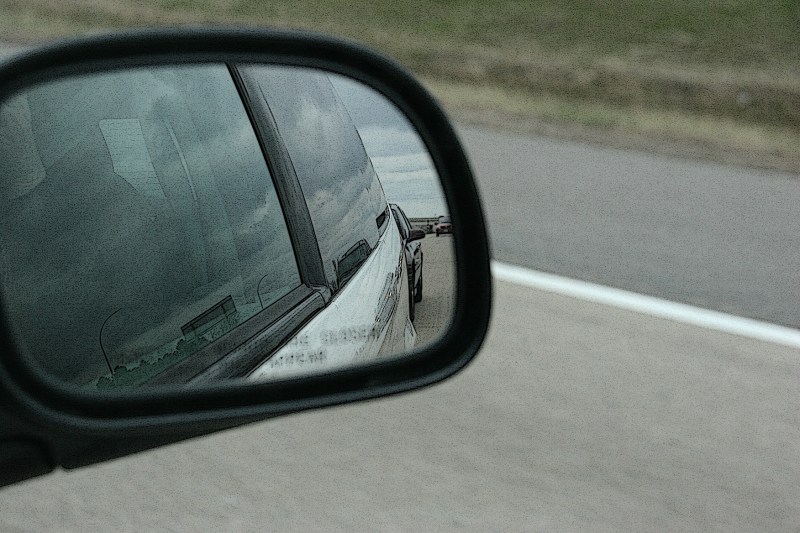 In this photo taken of the front passenger side mirror, you can see how close the tailgater is to our van.