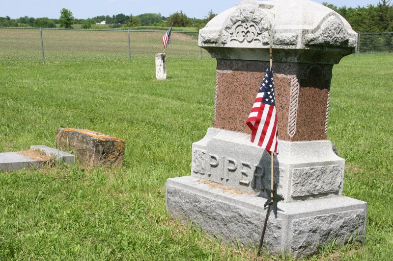 Fields surround the cemetery.