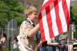 Parade, 28 Scout carrying&nbsp;flag