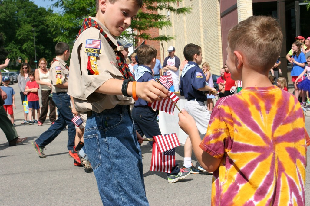 Parade, 32 Scout handing out flags