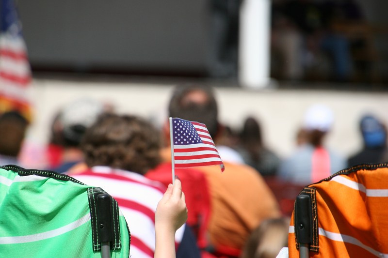 A child waves a flag.