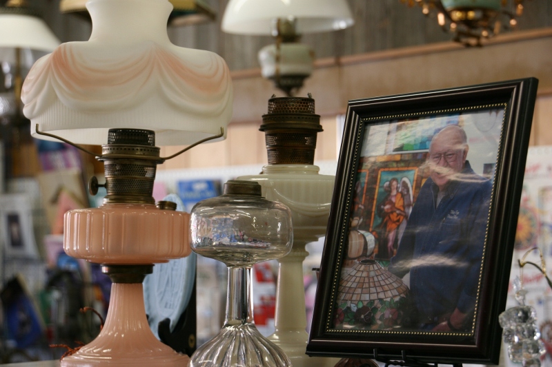 Mike also collects and sells lamps like these showcased next to his photo.