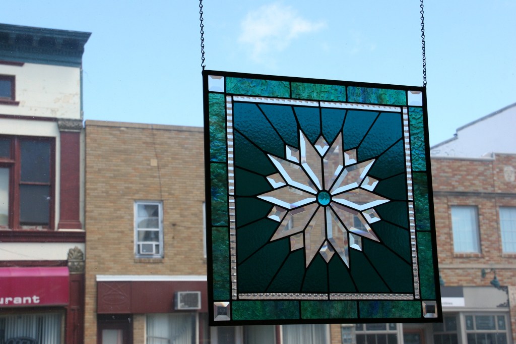 Hanging in the front window, sunlight really showcases the stained glass art.