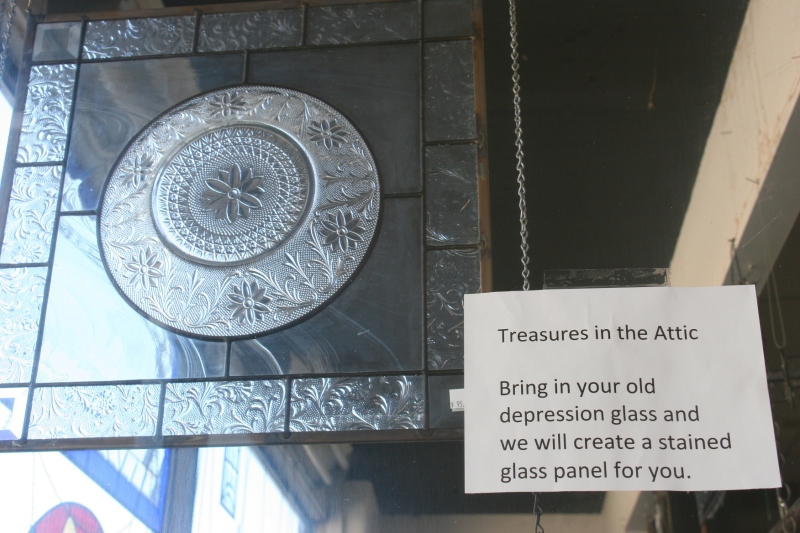 A sign in a window offers a creative option in stained glass.