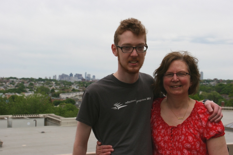 My son and I pose atop the Tisch Library with the Boston skyline as a backdrop.