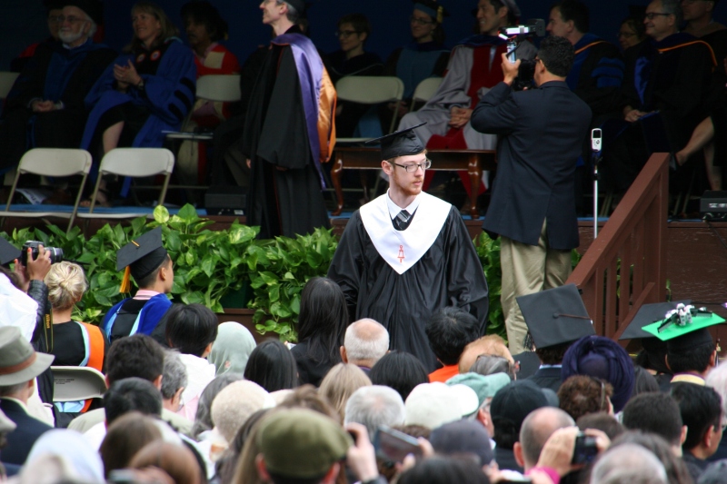 Caleb returns to his seat after graduating from Tufts University School of Engineering with a bachelor of science degree in computer science.