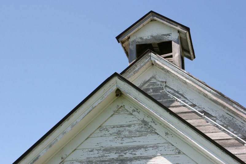 Three rooflines: entry, classroom and bell tower.