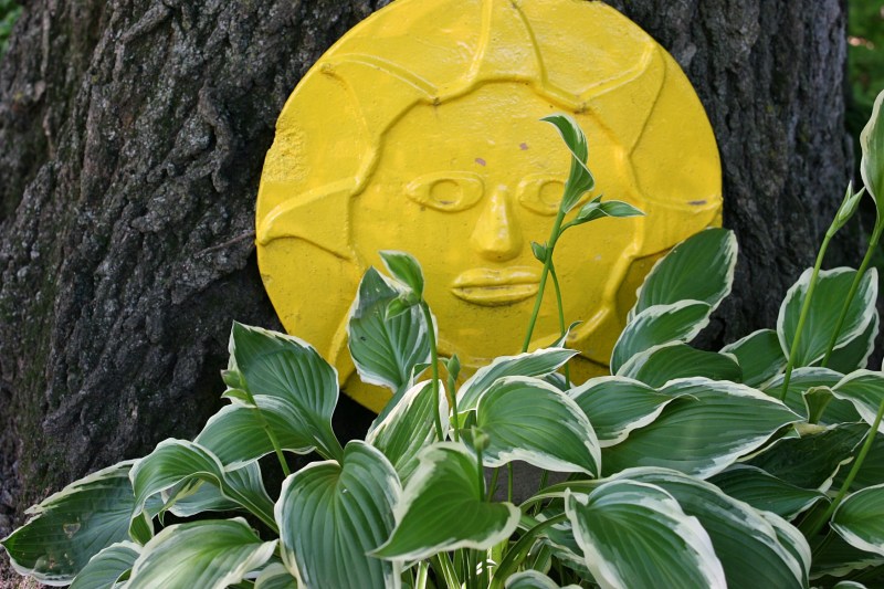 The sun sculpture bursts color into the shade.