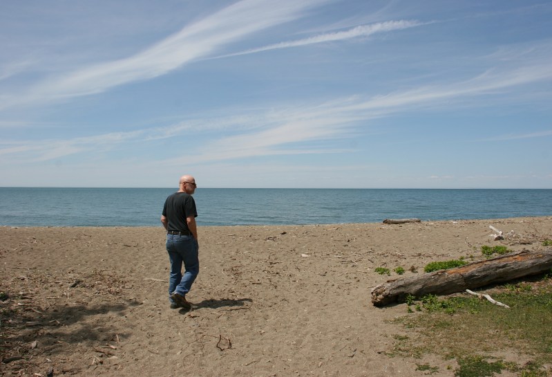 Randy walking along the shore of Lake Erie on a recent road trip to the East Coast.