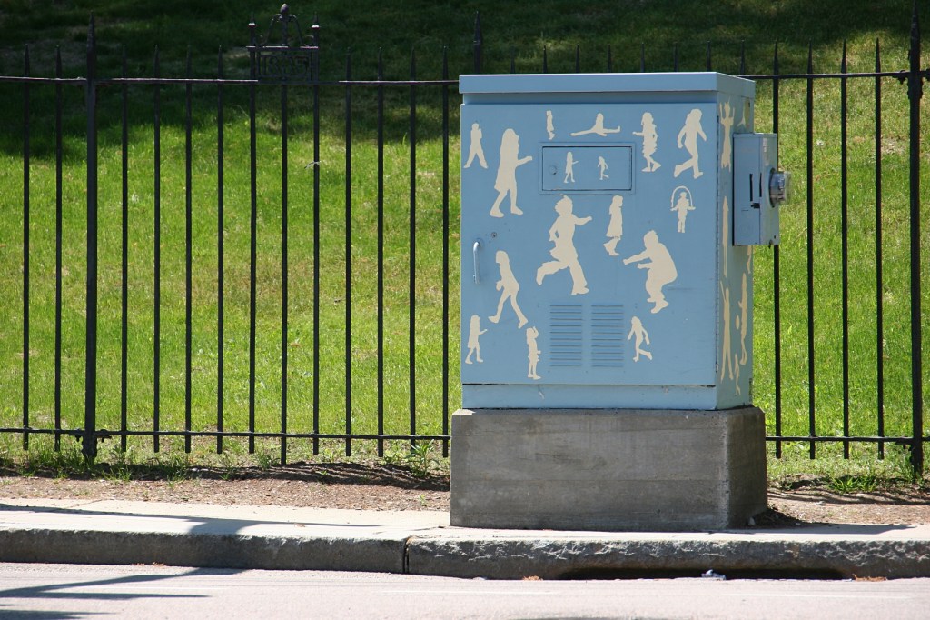 Art on a utility box by campus.