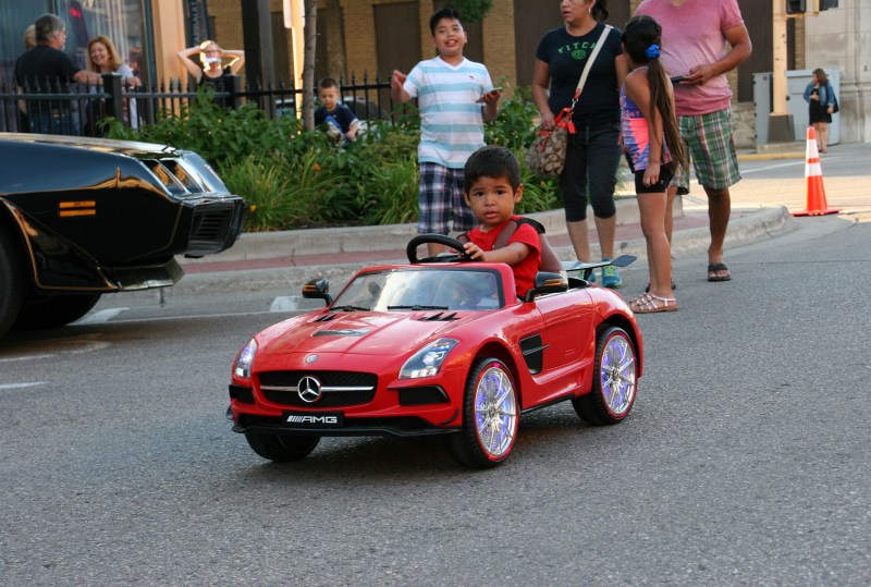 Boy in his Mercedes, 72 family following car