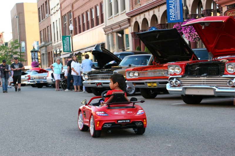 Boy in his Mercedes, 76 driving away