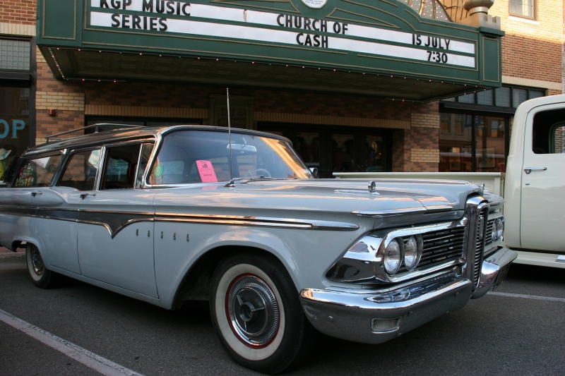A 1959 Edsel Village Wagon is parked in front of the Paradise Center for the Arts with its restored marquee.