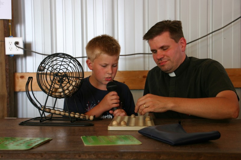 The Rev. Juan Palma of Trinity Lutheran Church North Morristown teams up with his son to call bingo.