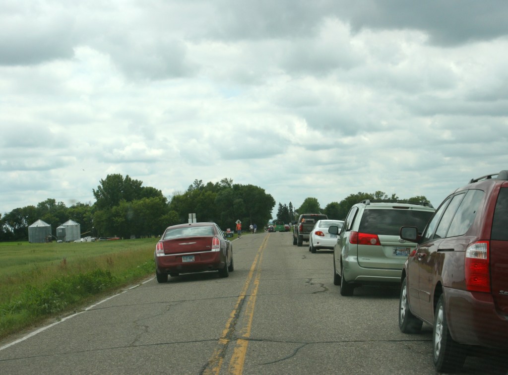 Vehicles lined county roads leading to the festival grounds and also filled parking areas.