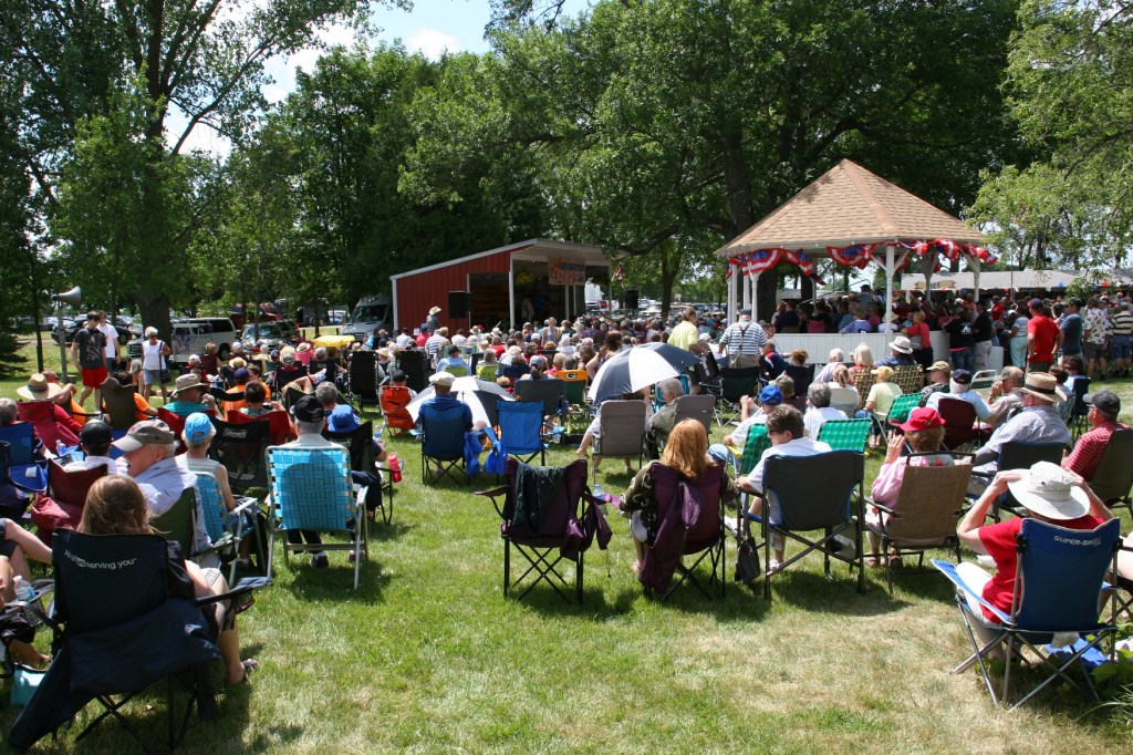 An appreciative crowd listens to Monroe Crossing, a popular bluegrass band.