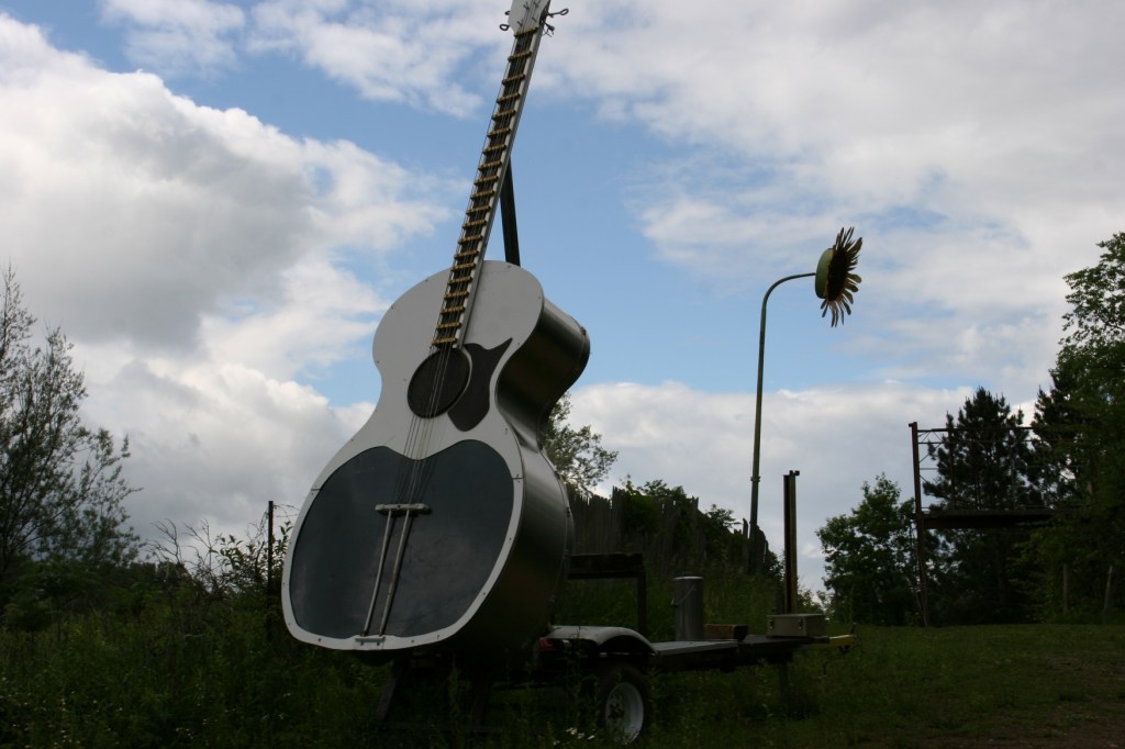 This guitar sculpture and other sculptures are perched atop a hill along Interstate 35 south of Lakeville.