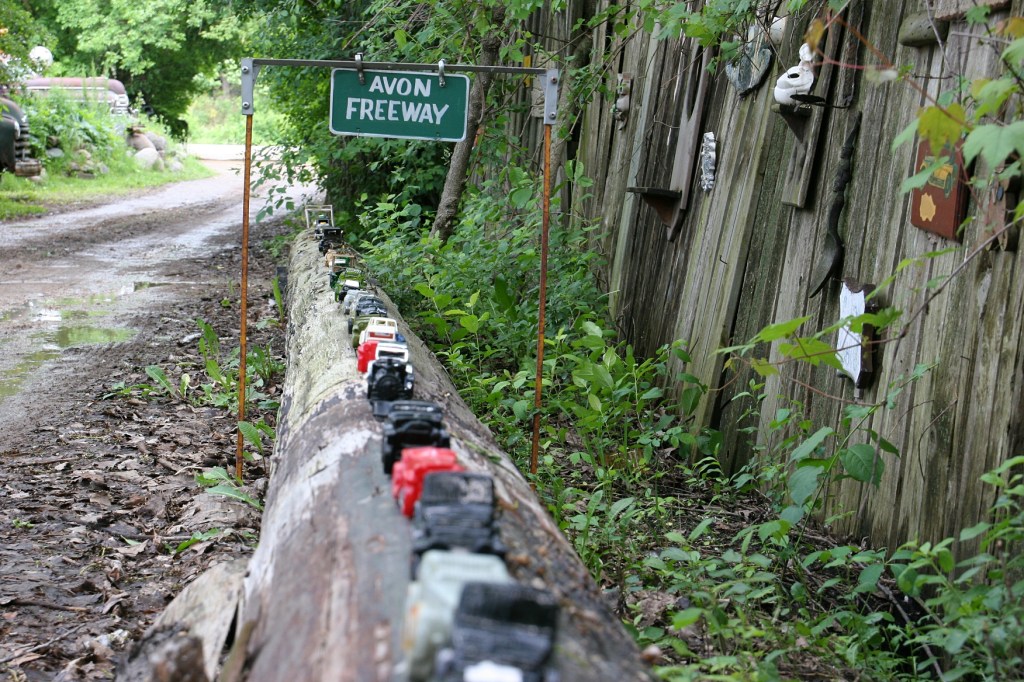 The Avon Freeway is new since my last visit to Hot Sam's several years ago. Avon collectible vehicles line this log along the driveway.
