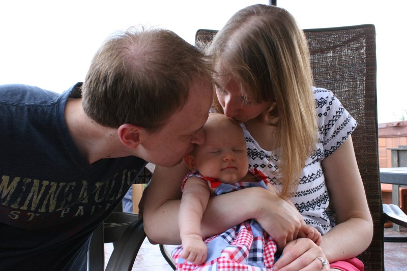 At the exact moment Marc and Amber kissed their daughter, Isabelle closed her eyes in contentment. This photo was not staged; it's a moment of sweet family love I managed to capture.