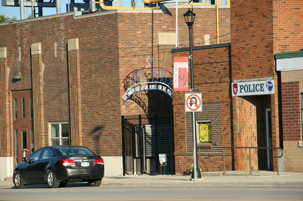 Stopped at an intersection in Kenyon, I snapped this quick photo of the Kenyon Police Department office. The yellow sign in the KPD window reads "Every Life Matters."
