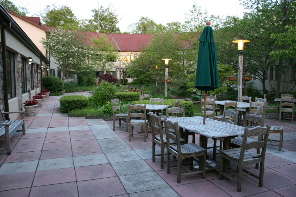 A lovely courtyard filled with plants and with a water feature offers a lovely place to dine outside the Courtyard Cafe.