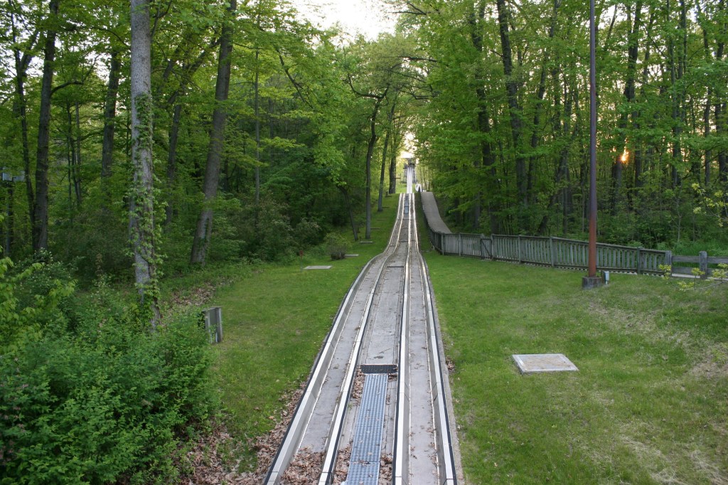 The Civilian Conservation Corps built the original wooden toboggan run in 1935. It was updated through the years to a refrigerated slide.