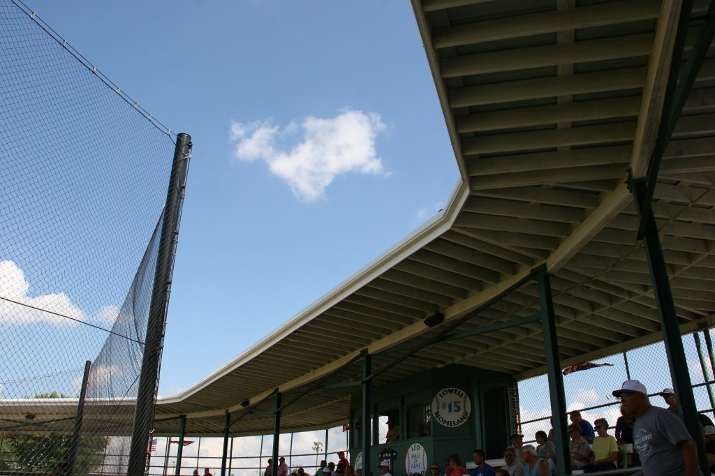 The roofed grandstand keeps fans cool.