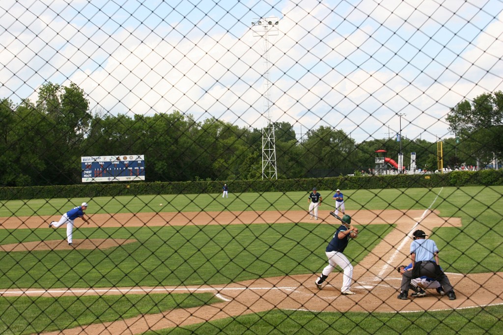 Lane's pitch speeds toward the batter.