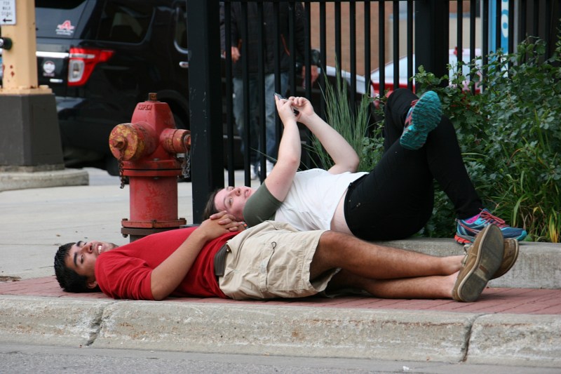 I always people watch. I have no idea why this couple was lying on the sidewalk at the intersection of Central Avenue and Fourth Street.