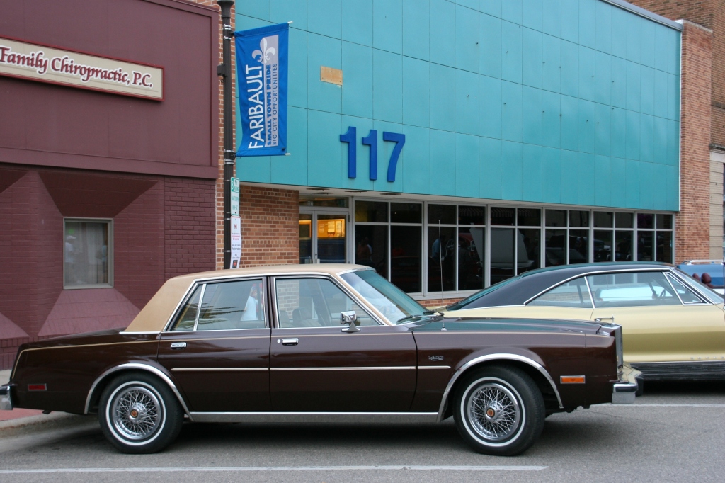 This Chrysler LeBaron doesn't seen all that old to me. That tells me something. I like the plain canvas backdrop of building #117, which has always been a mystery to me.