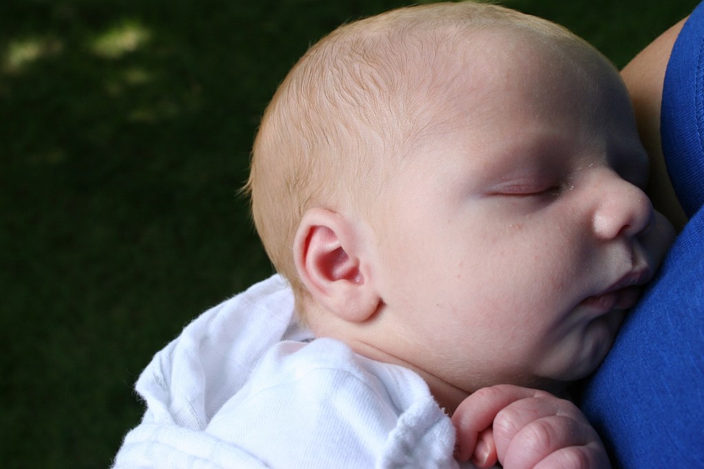 Baby Emmett was passed from arm to arm.